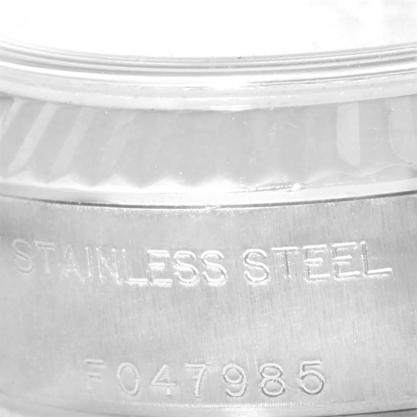 The image shows a close-up view of the stainless steel case and serial number of a Rolex Datejust 79174 Women's Stainless Steel Grey Dial 79174 Women's Stainless Steel Grey Dial watch.