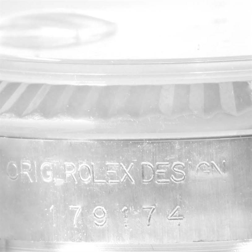 This image shows a close-up of the case side of a Rolex Datejust 179174 Women's Stainless Steel Mother of Pearl Dial 179174 Women's Stainless Steel Mother of Pearl Dial, featuring the model number and design engraving.