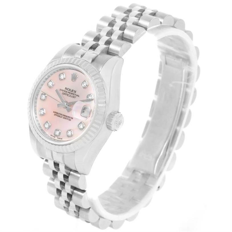 The image shows a Rolex Datejust 179174 Women's Stainless Steel Mother of Pearl Dial 179174 Women's Stainless Steel Mother of Pearl Dial watch at an angled side view, highlighting the pink dial, diamond markers, crown, and Jubilee bracelet.