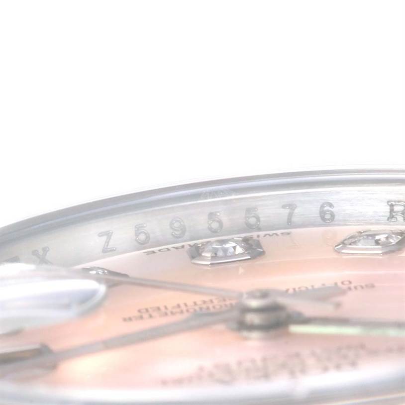 This image shows a close-up, angled view of the dial and chapter ring of a Rolex Datejust 179174 Women's Stainless Steel Mother of Pearl Dial 179174 Women's Stainless Steel Mother of Pearl Dial watch, highlighting the serial number.