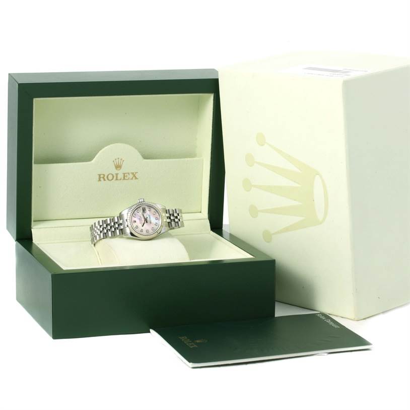 The image shows a Rolex Datejust 179174 Women's Stainless Steel Mother of Pearl Dial 179174 Women's Stainless Steel Mother of Pearl Dial watch in an open green and cream Rolex box, accompanied by an outer box and a booklet.