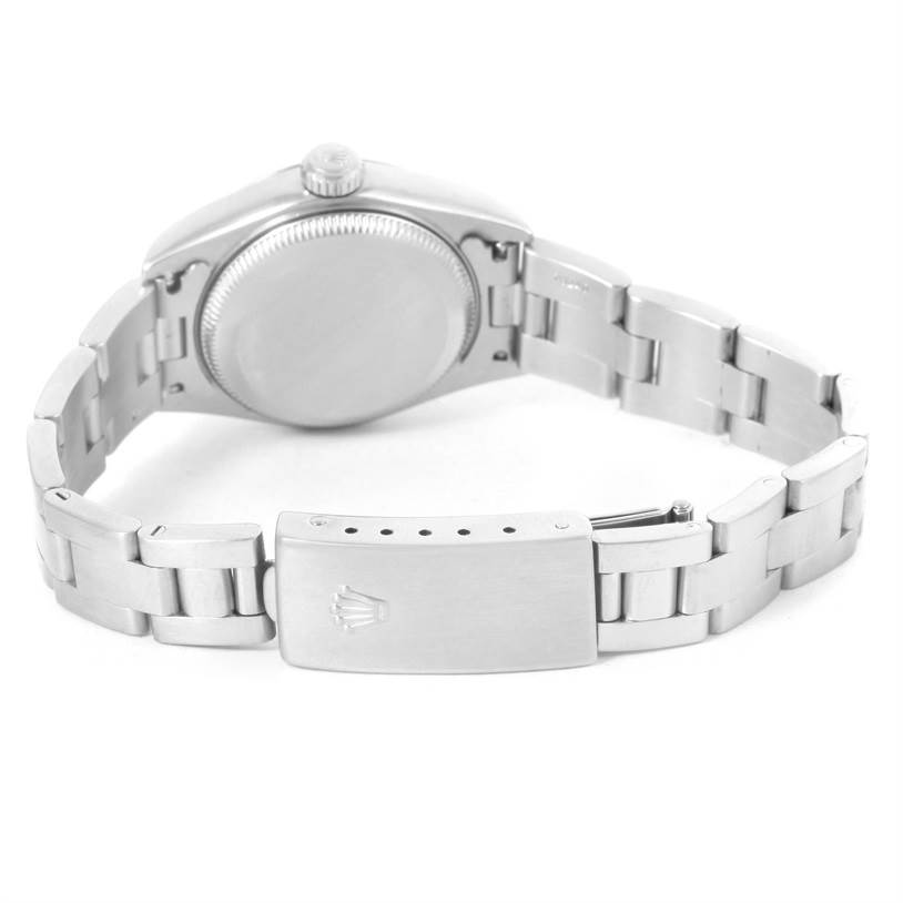 The image shows the back view of a Rolex Datejust 79174 Women
s Stainless Steel Silver Dial 79174 Women
s Stainless Steel Silver Dial watch, highlighting the case back, crown, and buckle of its metal bracelet.