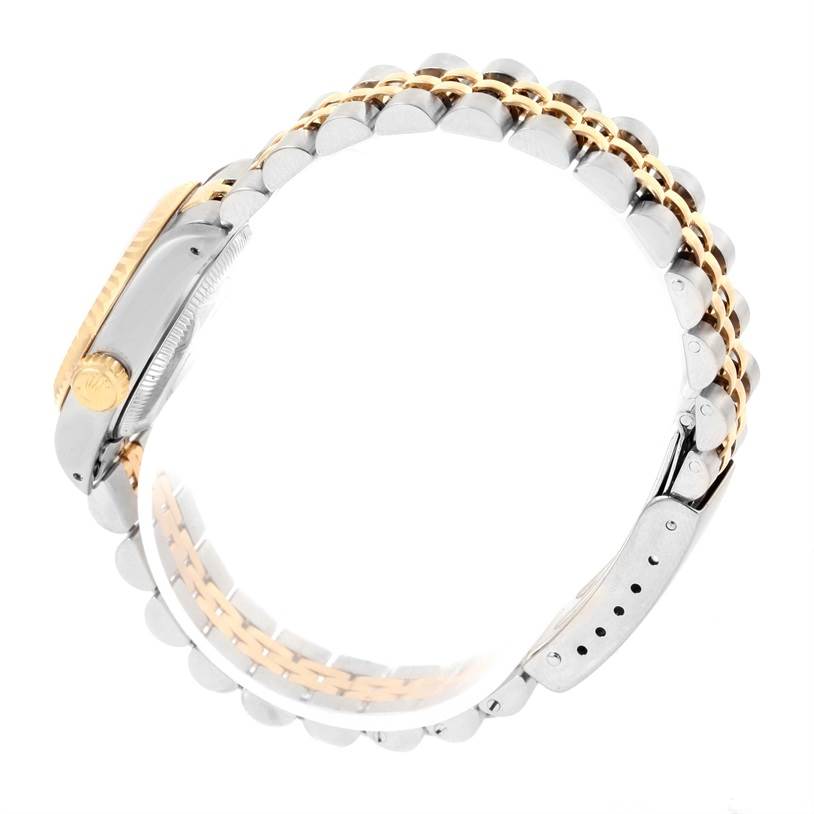 The image shows a side view of a Rolex Datejust 69173 Women
s Stainless Steel Silver Dial 69173 Women
s Stainless Steel Silver Dial, focusing on its two-tone bracelet and the side of the case.