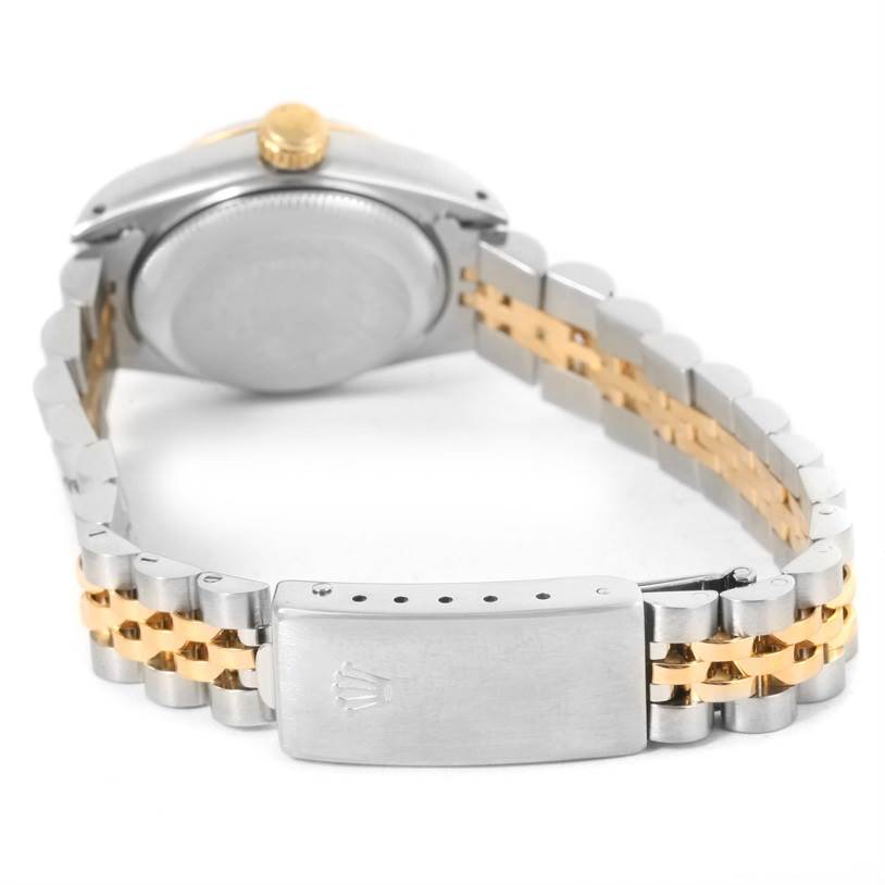 This Rolex Datejust 69173 Women
s Stainless Steel Silver Dial 69173 Women
s Stainless Steel Silver Dial watch is shown from the back, highlighting the case and closed clasp of the two-tone bracelet.