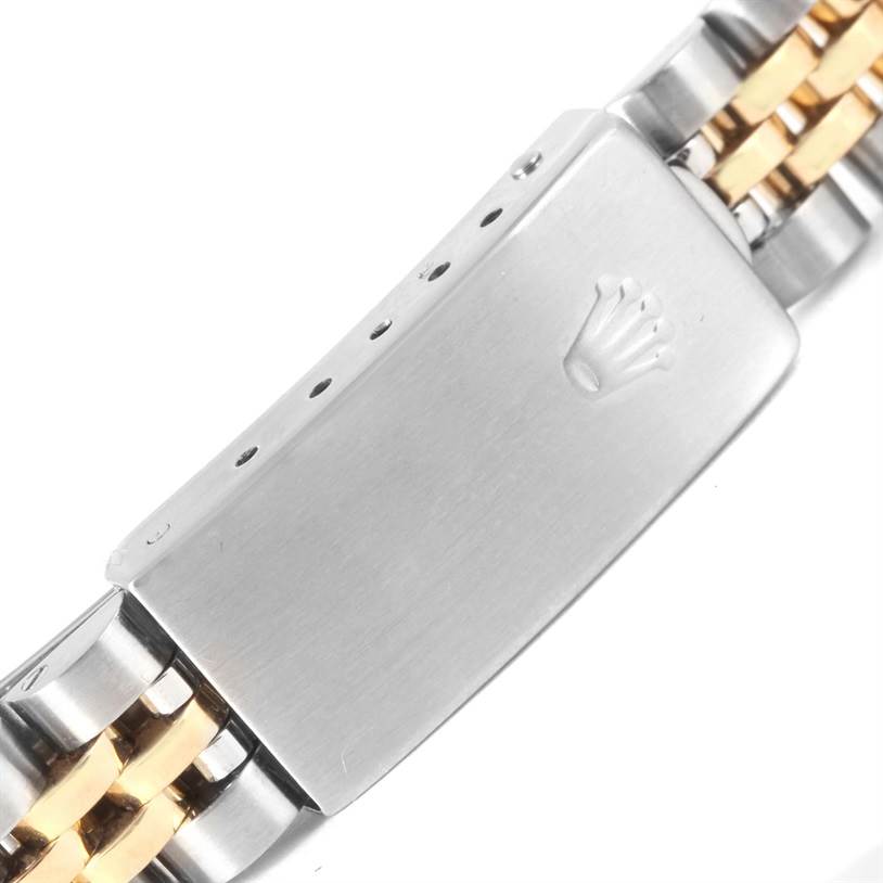 This image shows the clasp of a Rolex Datejust 69173 Women
s Stainless Steel Champagne Dial 69173 Women
s Stainless Steel Champagne Dial watch, featuring a two-tone metal design and the Rolex crown logo.