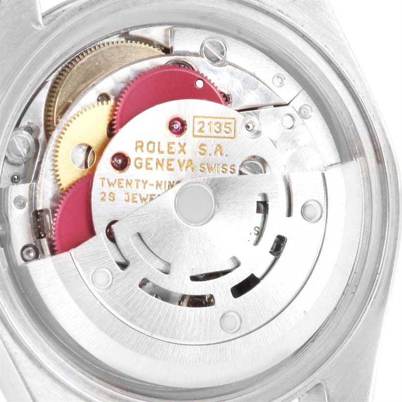 The image shows the internal mechanism of a Rolex Datejust 69173 Women
s Stainless Steel Champagne Dial 69173 Women
s Stainless Steel Champagne Dial watch, highlighting the gears and movement components.