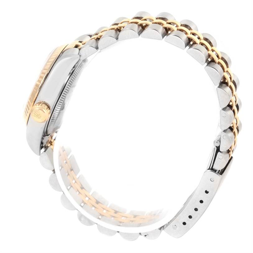 The image shows a side view of the Rolex Datejust 69173 Women
s Stainless Steel Champagne Dial 69173 Women
s Stainless Steel Champagne Dial watch, highlighting its bracelet and crown.