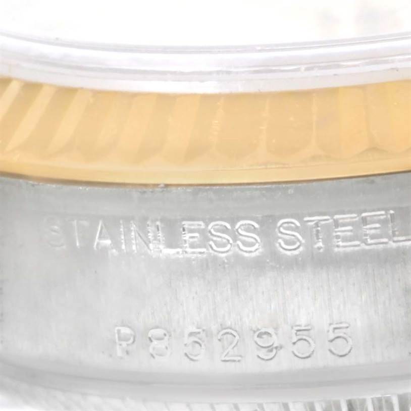 The image shows a close-up of the side of a Rolex Datejust 79173 Women
s Stainless Steel Champagne Dial 79173 Women
s Stainless Steel Champagne Dial watch, focusing on the stainless steel case and part of the bezel.