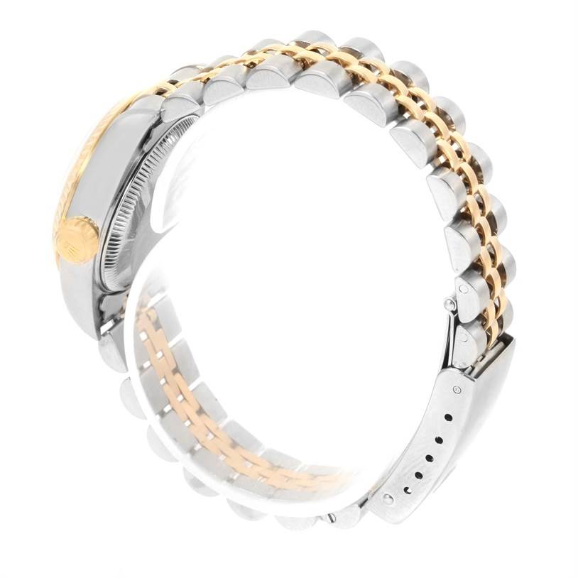 The image shows a side view of the Rolex Datejust 79173 Women
s Stainless Steel Champagne Dial 79173 Women
s Stainless Steel Champagne Dial model, focusing on its two-tone bracelet and crown.