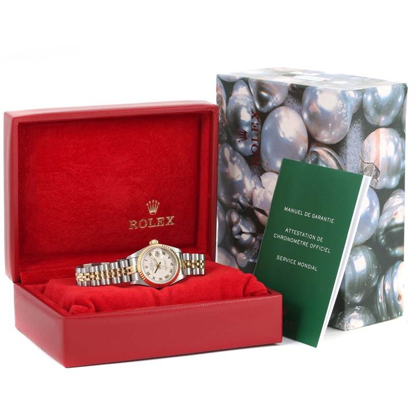 The image displays a Rolex Datejust 79173 Women's Stainless Steel Beige Dial 79173 Women's Stainless Steel Beige Dial watch in an open red box, along with its original packaging and accompanying booklet.