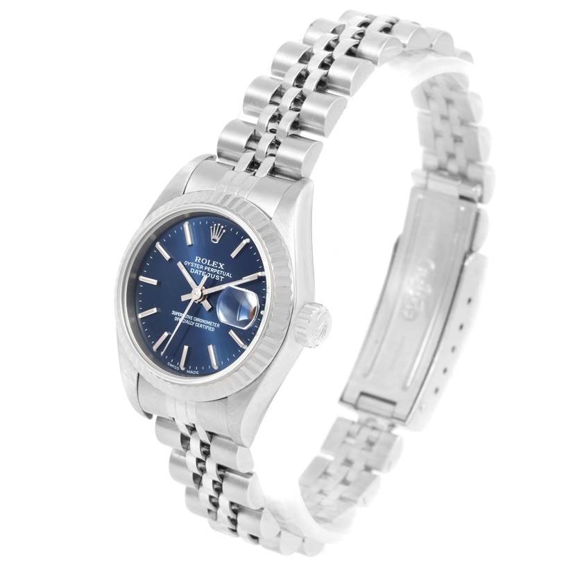 The Rolex Datejust 79174 Women's Stainless Steel Blue Dial 79174 Women's Stainless Steel Blue Dial watch is shown at an angle displaying its blue dial, bracelet, and partially opened clasp.