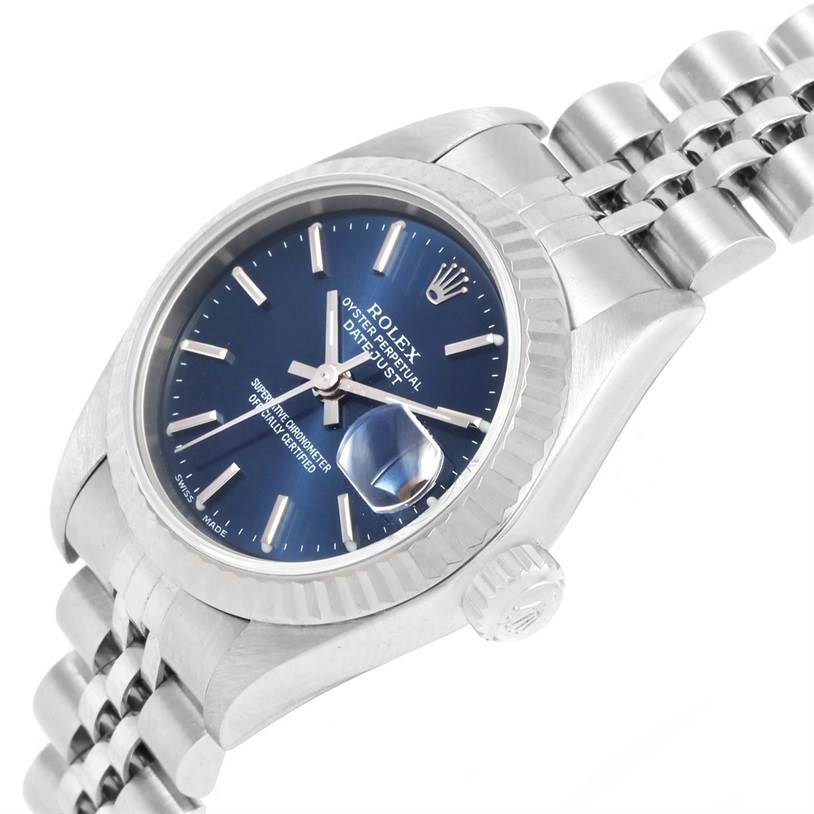 The image shows a Rolex Datejust 79174 Women's Stainless Steel Blue Dial 79174 Women's Stainless Steel Blue Dial watch angled to display the face, crown, and part of the bracelet.