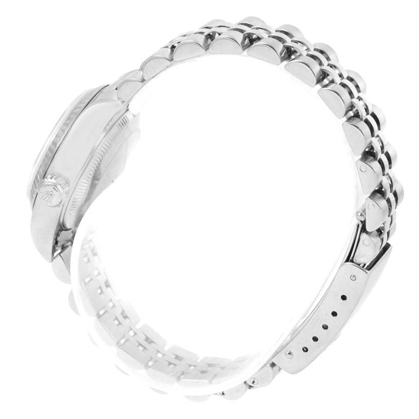 The image shows a side view of a Datejust model by Rolex, highlighting the crown, case, and bracelet clasp.