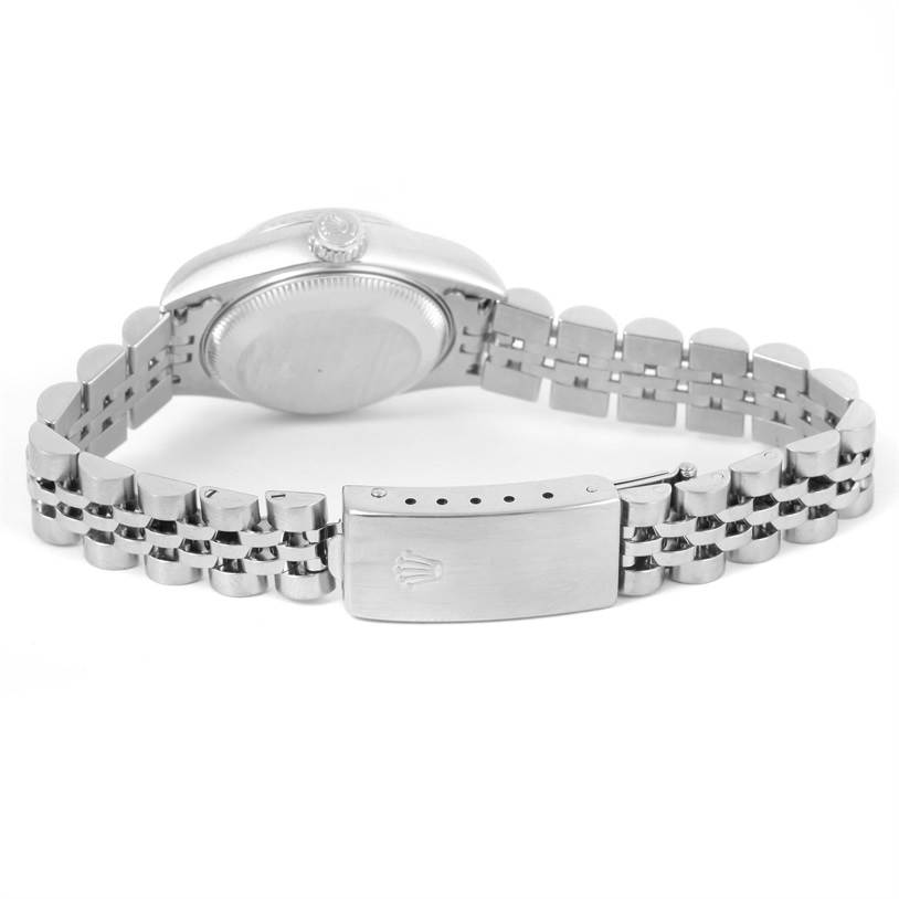 The image shows the back view of a Rolex Datejust 79174 Women's Stainless Steel Blue Dial 79174 Women's Stainless Steel Blue Dial watch, focusing on the case back and the bracelet with the clasp.