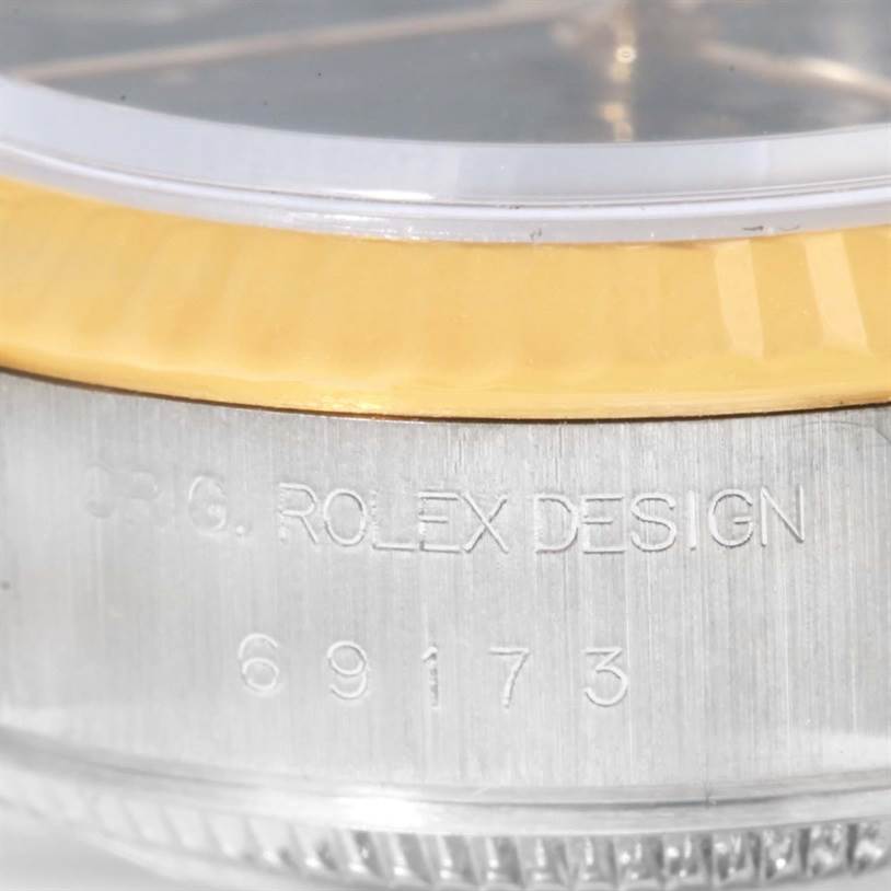 The image shows a close-up of the side of a Rolex Datejust 69173 Women
s Stainless Steel Black Dial 69173 Women
s Stainless Steel Black Dial watch case, displaying the model number "69173."