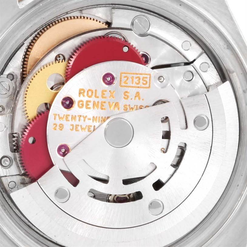 The image shows the internal mechanism of the Rolex Datejust 69173 Women
s Stainless Steel Black Dial 69173 Women
s Stainless Steel Black Dial watch, highlighting its gears and components.
