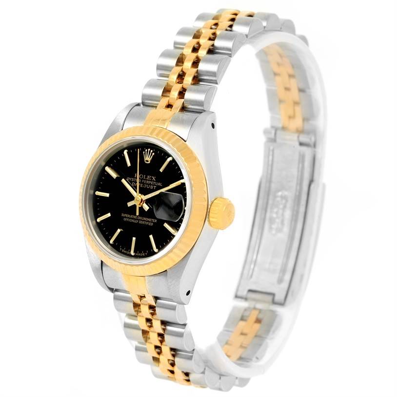 This image shows a Rolex Datejust 69173 Women's Stainless Steel Black Dial 69173 Women's Stainless Steel Black Dial watch at an oblique angle, highlighting its two-tone bracelet, black dial, and gold fluted bezel.