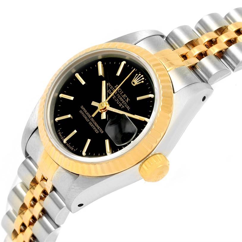 The image shows a close-up angle of the Rolex Datejust 69173 Women's Stainless Steel Black Dial 69173 Women's Stainless Steel Black Dial watch, highlighting the black dial, gold crown, and two-tone bracelet.