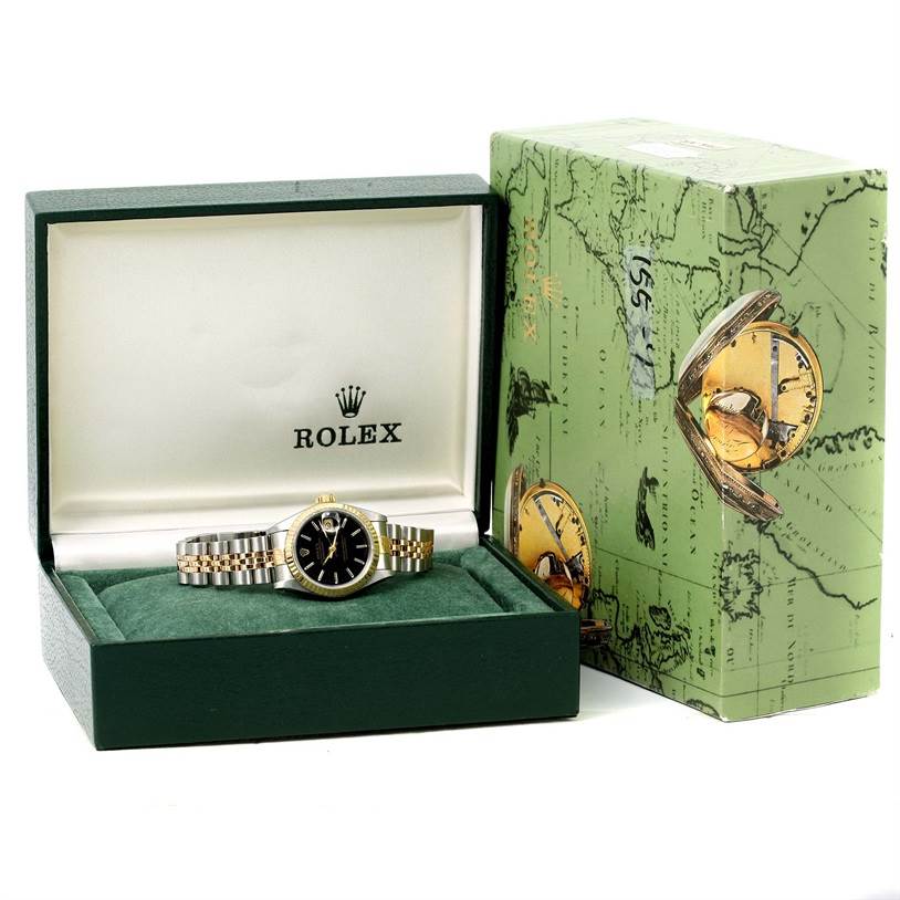 The image shows a Rolex Datejust 69173 Women's Stainless Steel Black Dial 69173 Women's Stainless Steel Black Dial watch placed in an open watch box, accompanied by an outer box next to it.