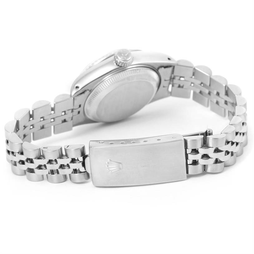 The image shows the backside of the Rolex Datejust 69174 Women's Stainless Steel Black Dial 69174 Women's Stainless Steel Black Dial watch, detailing the stainless steel case, bracelet, and clasp.