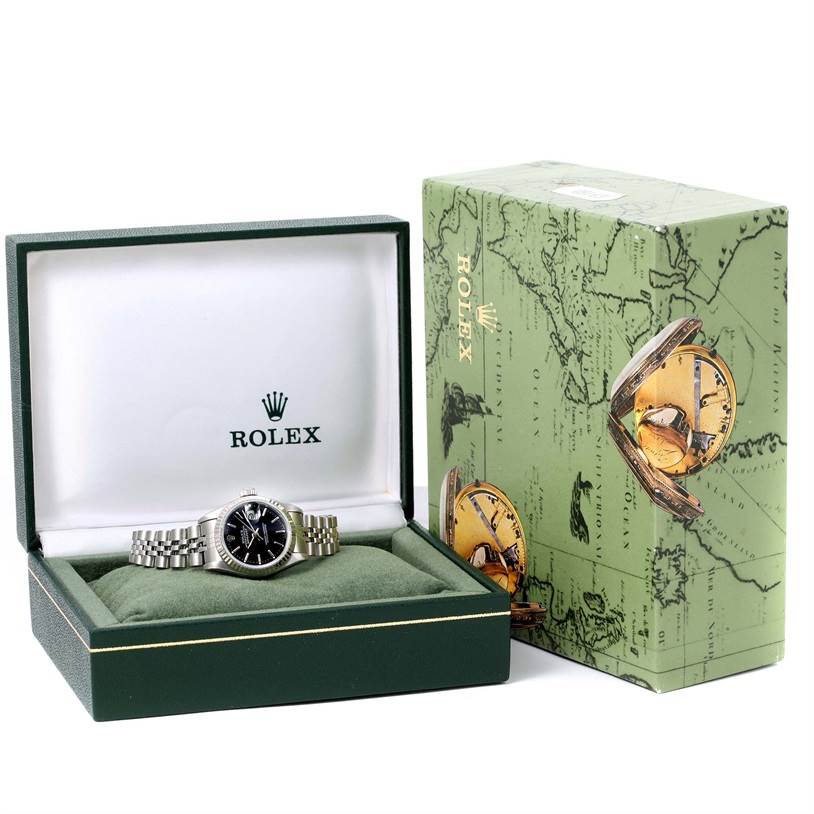 The image shows a Rolex Datejust 69174 Women's Stainless Steel Black Dial 69174 Women's Stainless Steel Black Dial watch in its open green box, with the outer packaging also displayed to the right.