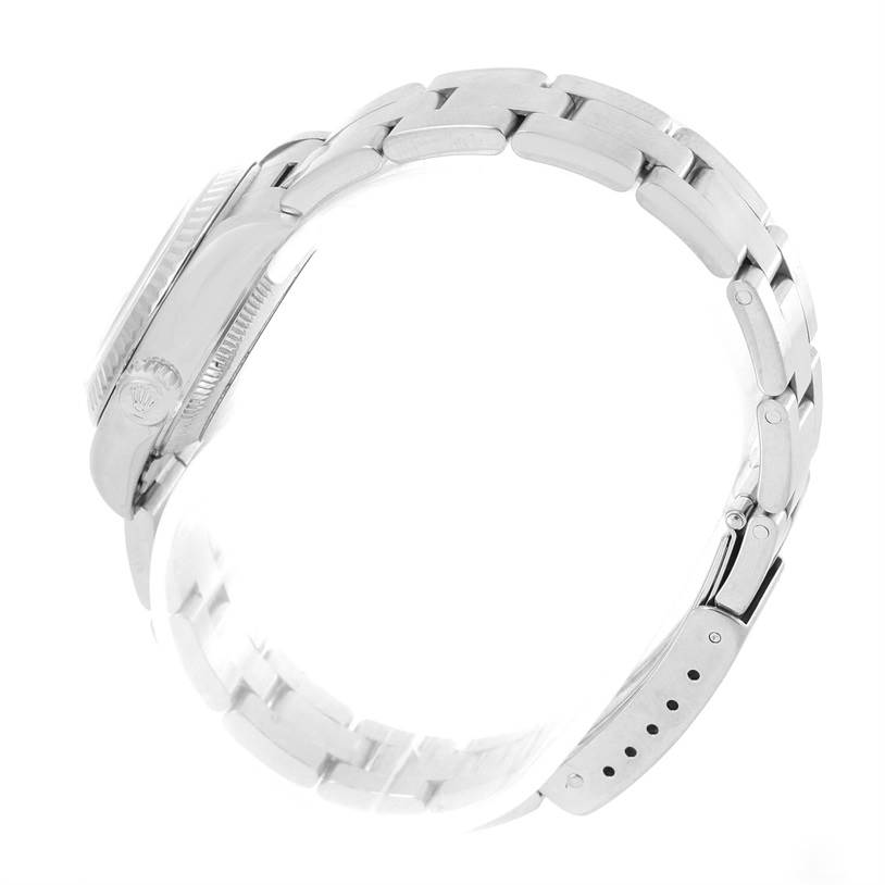 This image shows a side view of a Rolex Datejust 79174 Women's Stainless Steel Mother of Pearl Dial 79174 Women's Stainless Steel Mother of Pearl Dial watch, highlighting its case, crown, and bracelet with a clasp.