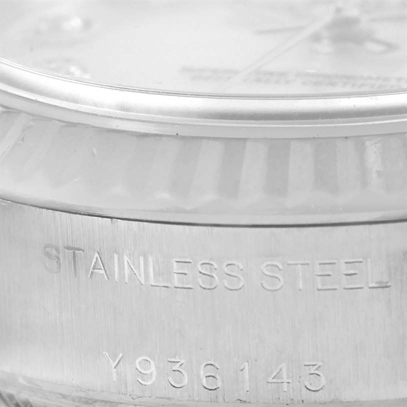This image shows a close-up angle of the Rolex Datejust 79174 Women's Stainless Steel Mother of Pearl Dial 79174 Women's Stainless Steel Mother of Pearl Dial watch focusing on the stainless steel case with its engraved serial number.