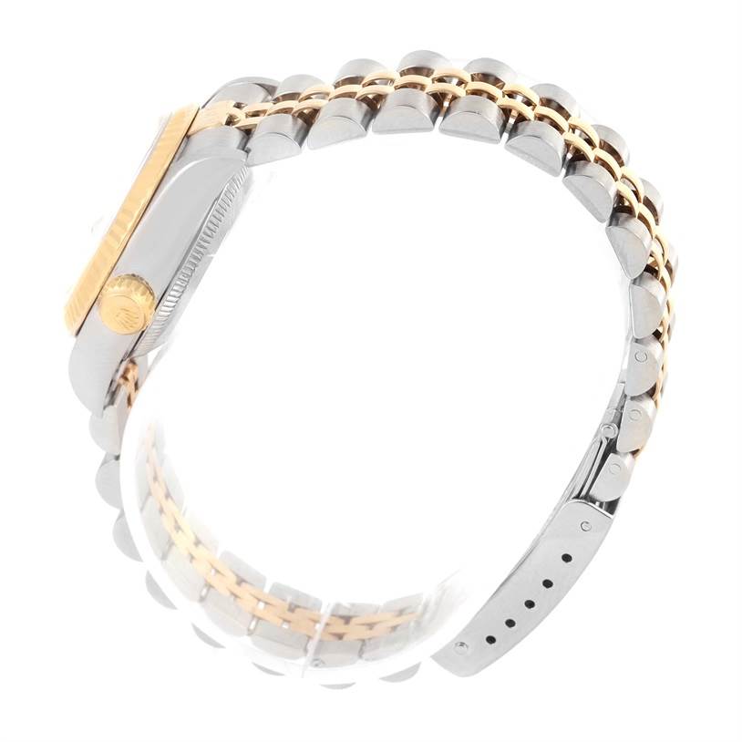 The image shows a Rolex Datejust 69173 Women
s Stainless Steel Champagne Dial 69173 Women
s Stainless Steel Champagne Dial watch from a side angle, highlighting the crown, case, and bracelet.