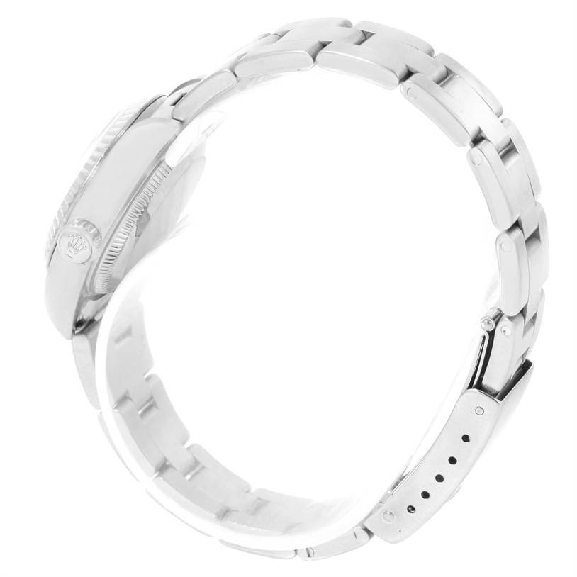 This image shows a side view of the Rolex Datejust 79174 Women
s Stainless Steel Silver Dial 79174 Women
s Stainless Steel Silver Dial watch, highlighting its bracelet, case, and closed clasp.