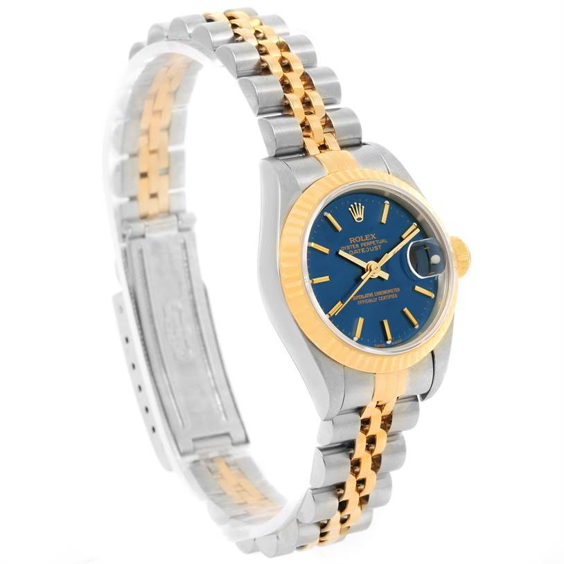 The image shows a Rolex Datejust 69173 Women's Stainless Steel Blue Dial 69173 Women's Stainless Steel Blue Dial watch, focusing on its blue dial, gold fluted bezel, and two-tone bracelet, angled from the front-left.