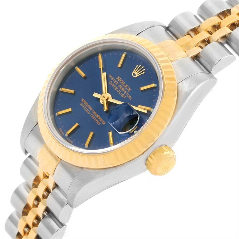 The watch is shown from a tilted angle, highlighting the blue dial, gold crown, and two-tone bracelet of the Rolex Datejust 69173 Women's Stainless Steel Blue Dial 69173 Women's Stainless Steel Blue Dial model.