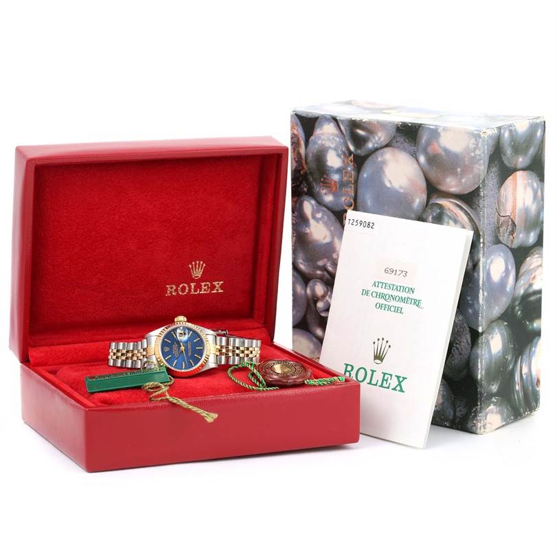 The Rolex Datejust 69173 Women's Stainless Steel Blue Dial 69173 Women's Stainless Steel Blue Dial watch is shown in its box with documentation and accessories from a front angle.