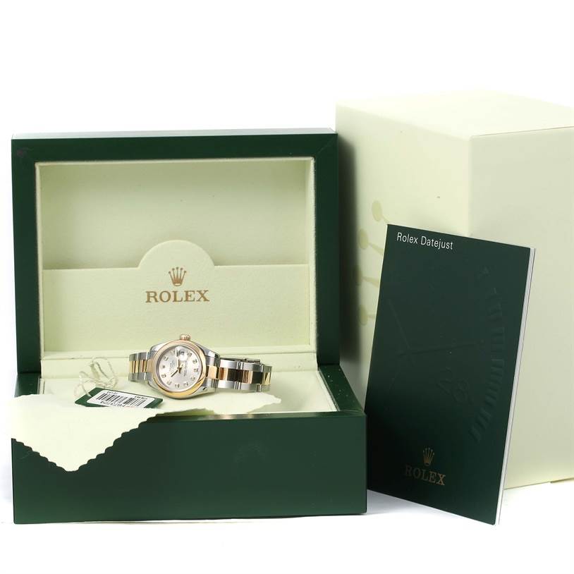 This image shows a Rolex Datejust 179163 Women's Steel and Gold (two tone) Silver Dial 179163 Women's Steel and Gold (two tone) Silver Dial watch in its box, along with its booklet and a cleaning cloth placed inside.