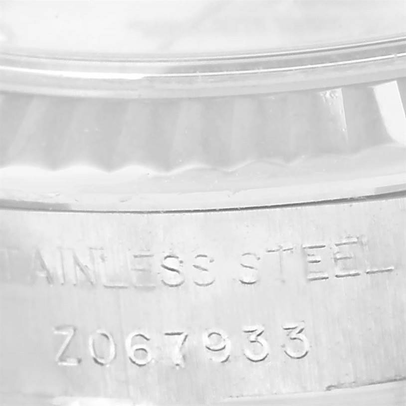 The image shows a close-up of the stainless steel case back engraving of a Rolex Datejust 179174 Women's Stainless Steel Mother of Pearl Dial 179174 Women's Stainless Steel Mother of Pearl Dial watch.