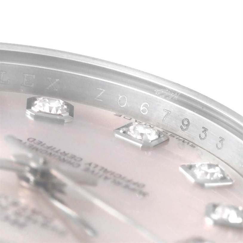 Close-up of the side of a Rolex Datejust 179174 Women's Stainless Steel Mother of Pearl Dial 179174 Women's Stainless Steel Mother of Pearl Dial watch, showing part of the bezel and diamond hour markers.