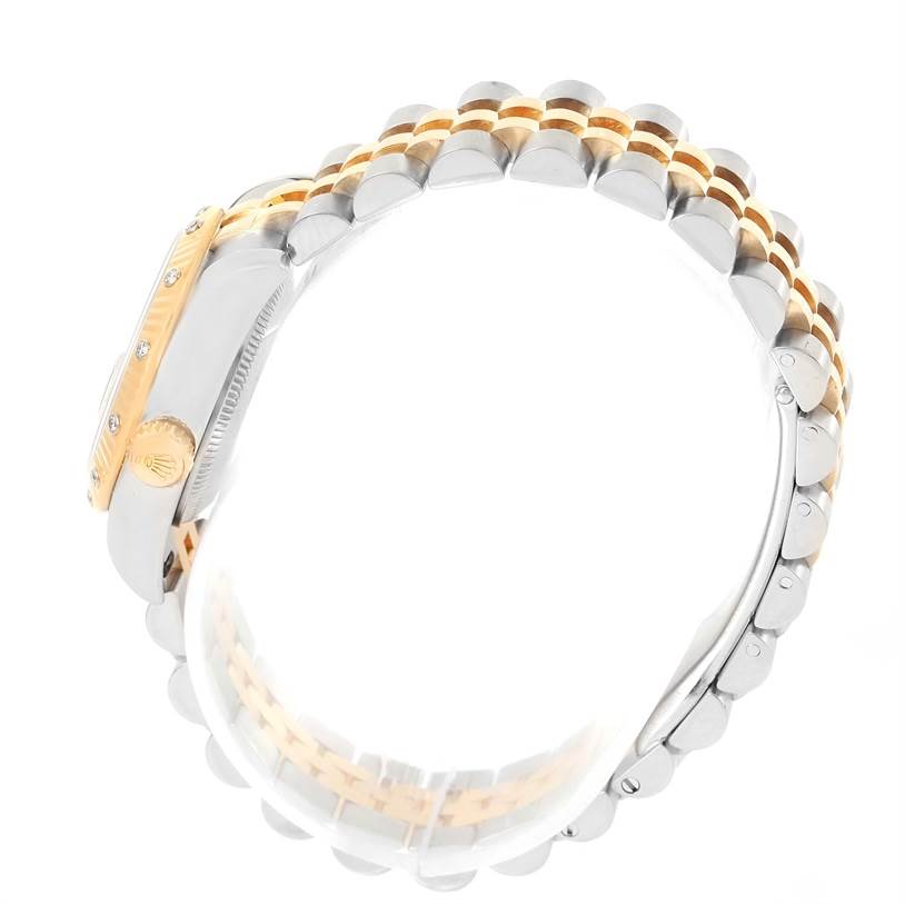 The image shows a side view of a Rolex Datejust 179313 Women's Black Dial 179313 Women's Black Dial watch, highlighting its two-tone bracelet and crown.