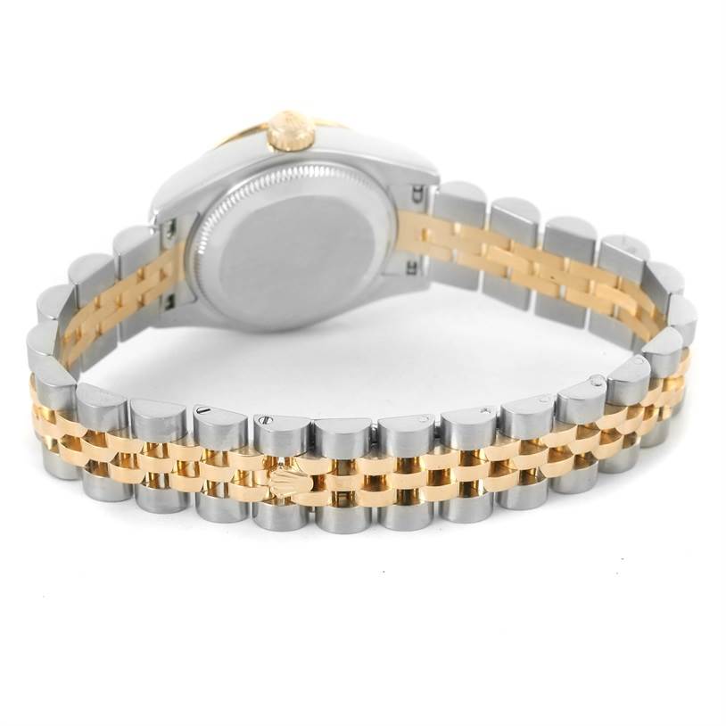 The image shows the back view of a Rolex Datejust 179313 Women's Black Dial 179313 Women's Black Dial watch, highlighting its two-tone metal bracelet and closed case back.