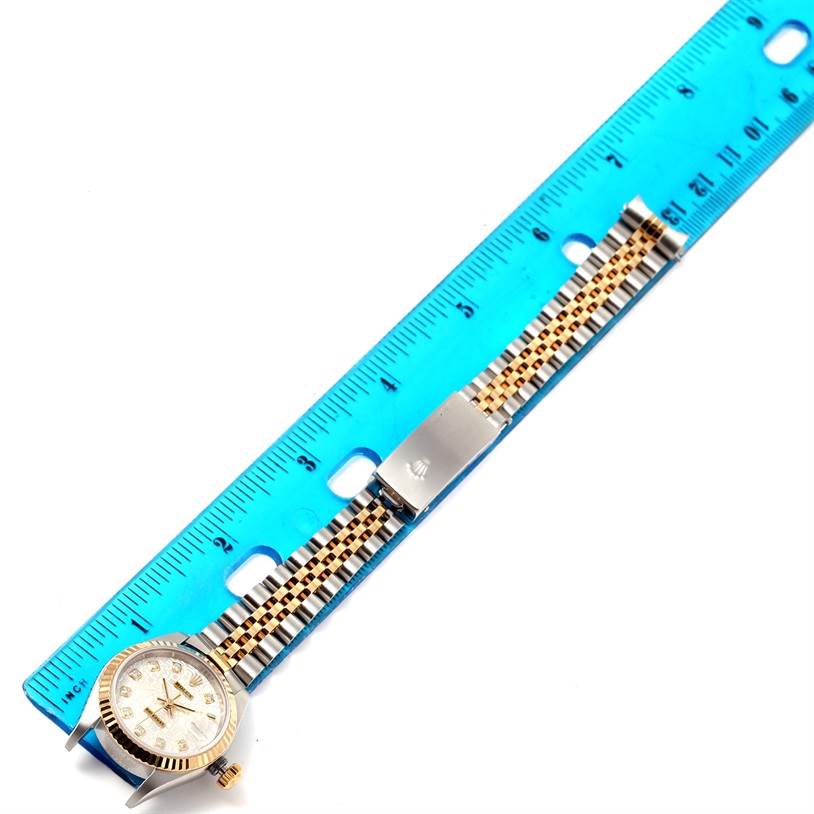 The image shows a Rolex Datejust 79173 Women's Stainless Steel Silver Dial 79173 Women's Stainless Steel Silver Dial watch laid flat next to a ruler, displaying the full watch with its bracelet and clasp.