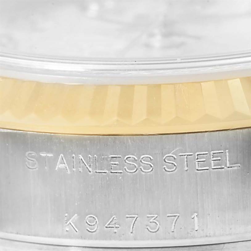 This close-up angle shows the stainless steel case and part of the fluted bezel of a Rolex Datejust 79173 Women's Stainless Steel Silver Dial 79173 Women's Stainless Steel Silver Dial watch.