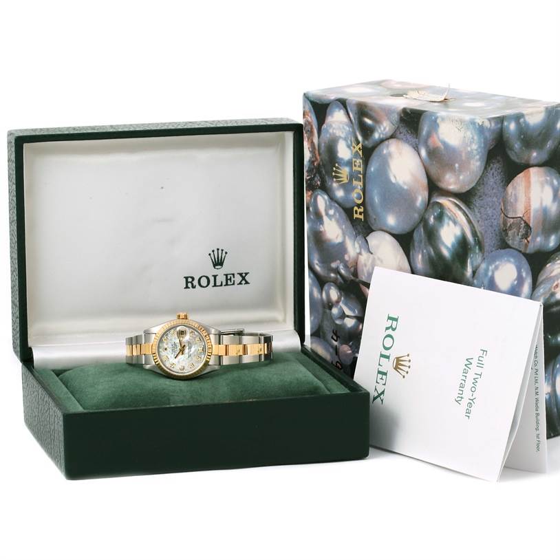The Rolex Datejust 79173 Women
s Stainless Steel Mother of Pearl Dial 79173 Women
s Stainless Steel Mother of Pearl Dial watch is displayed at a front angle, with packaging and a warranty booklet included.