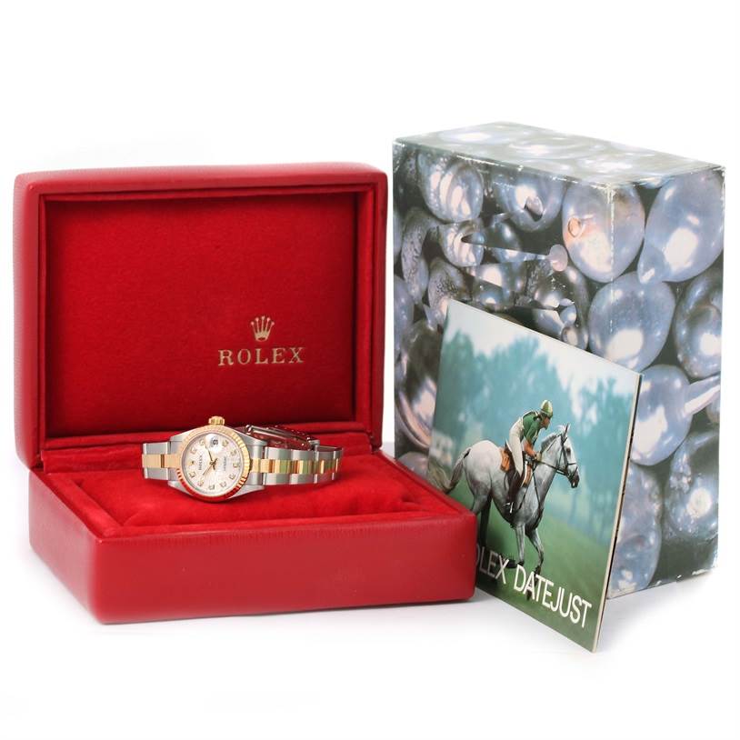 The image shows a Rolex Datejust 79173 Women's Stainless Steel Silver Dial 79173 Women's Stainless Steel Silver Dial watch displayed in an open red box, along with its packaging and booklet.