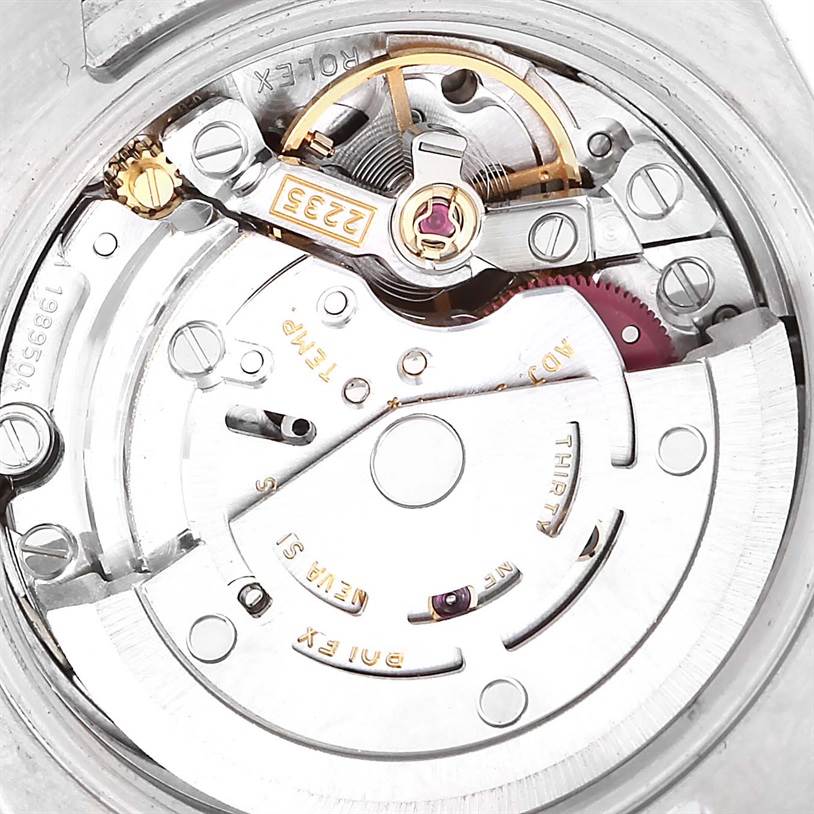 This is an angled view of the Rolex Datejust 179173 Women's Steel and Gold (two tone) Champagne Dial 179173 Women's Steel and Gold (two tone) Champagne Dial watch movement, showcasing the intricate internal mechanism and components.