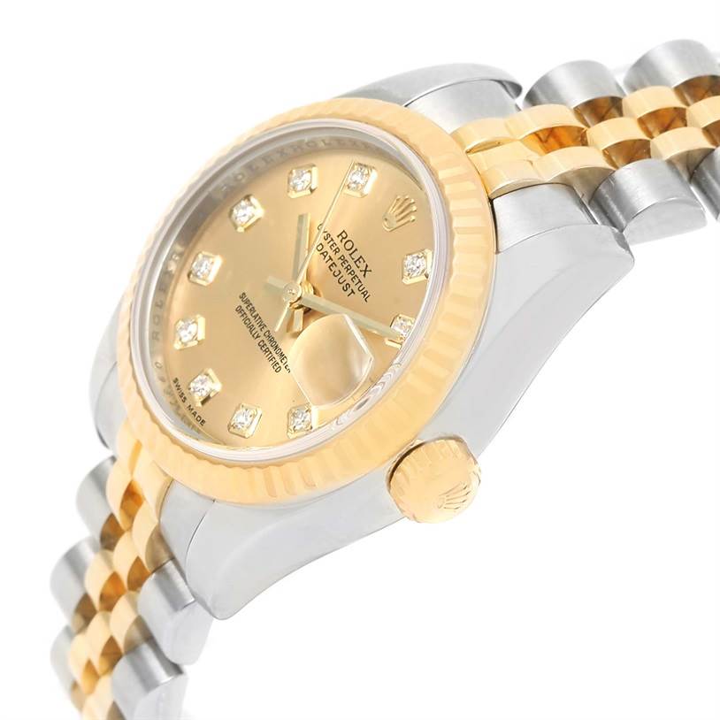 The image shows a close-up angled view of a Rolex Datejust 179173 Women's Steel and Gold (two tone) Champagne Dial 179173 Women's Steel and Gold (two tone) Champagne Dial watch, highlighting the dial, bezel, crown, and part of the bracelet.