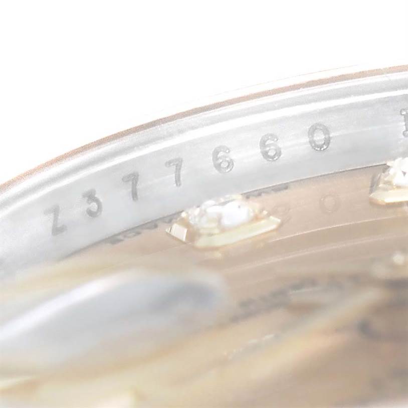 This close-up image shows the serial number engraved on the rehaut of a Rolex Datejust 179173 Women's Steel and Gold (two tone) Champagne Dial 179173 Women's Steel and Gold (two tone) Champagne Dial watch.
