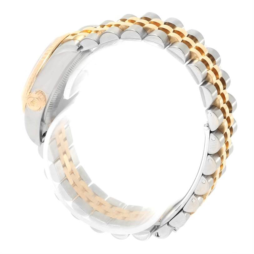 The image shows a side view of the Rolex Datejust 179173 Women's Steel and Gold (two tone) Champagne Dial 179173 Women's Steel and Gold (two tone) Champagne Dial watch, focusing on its two-tone bracelet and side of the case with the crown.