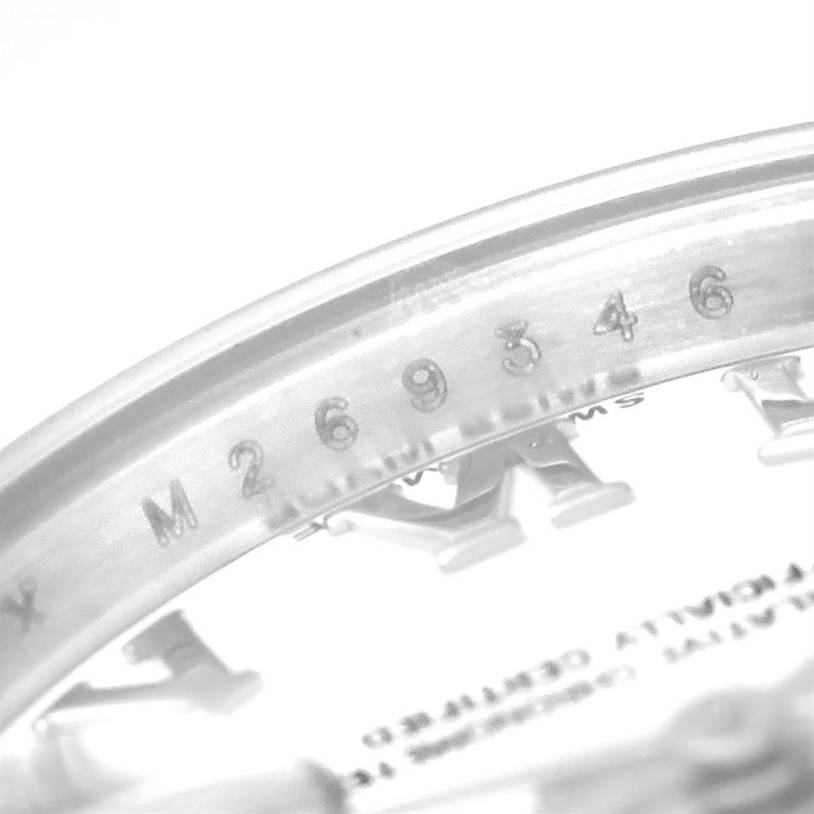 The image shows a close-up of the Rolex Datejust 179174 Women's Stainless Steel White Dial 179174 Women's Stainless Steel White Dial model, focusing on the serial number and parts of the dial.