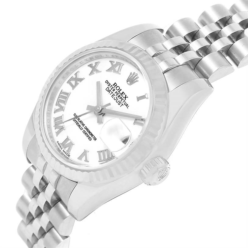 This Rolex Datejust 179174 Women's Stainless Steel White Dial 179174 Women's Stainless Steel White Dial watch is shown at an angled view, highlighting its dial, fluted bezel, crown, and part of the Jubilee bracelet.