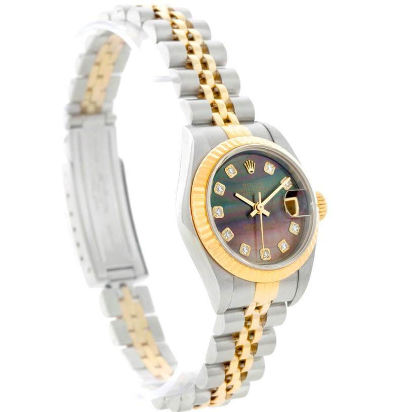 The image shows a Rolex Datejust 79173 Women's Steel and Gold (two tone) Mother of Pearl Dial 79173 Women's Steel and Gold (two tone) Mother of Pearl Dial watch displaying its face, bezel, and two-tone bracelet from a side angle.