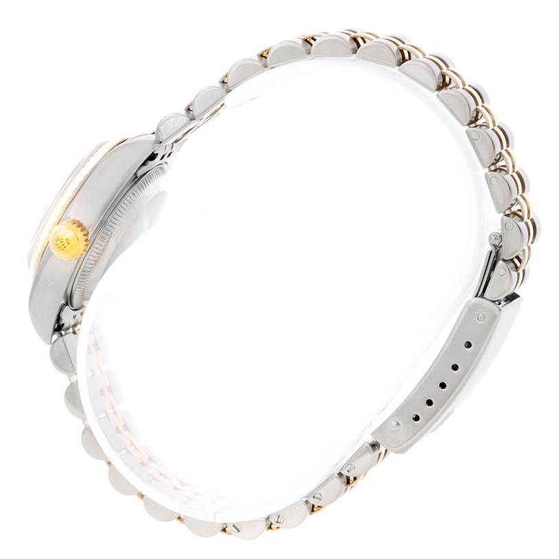 The Rolex Datejust 79173 Women's Steel and Gold (two tone) Mother of Pearl Dial 79173 Women's Steel and Gold (two tone) Mother of Pearl Dial watch is shown in a side view, highlighting the crown, case, and bracelet.