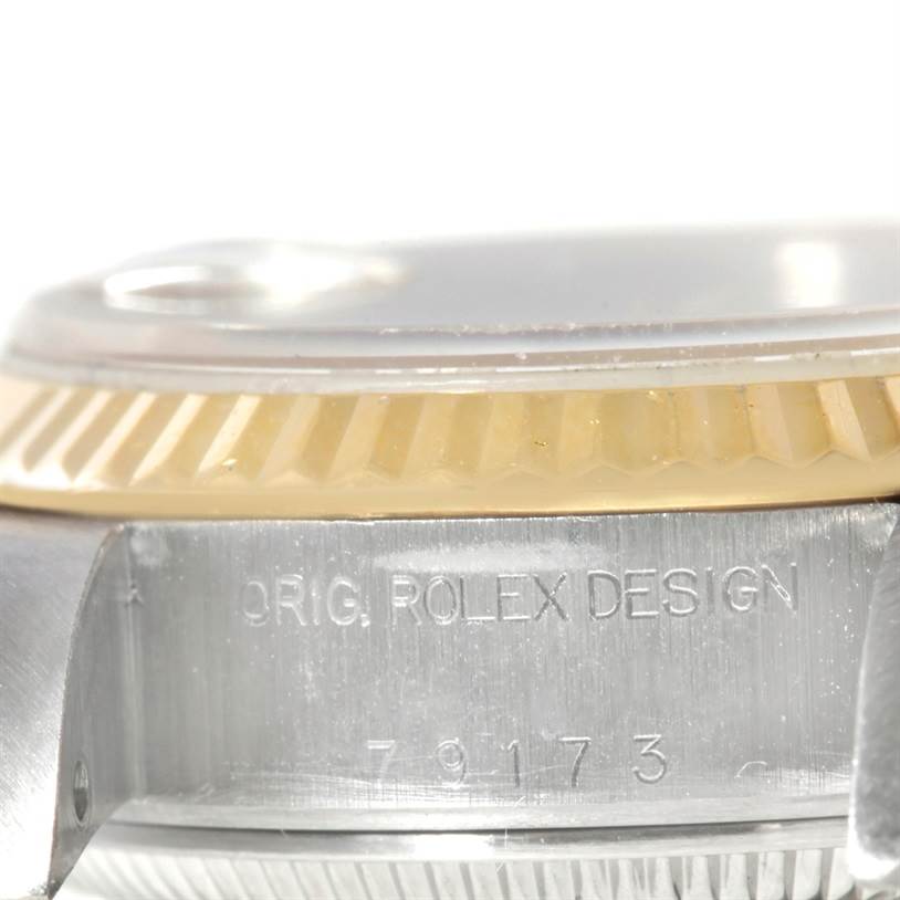 This close-up image shows the side profile, bezel, and part of the case of a Rolex Datejust 79173 Women's Steel and Gold (two tone) Mother of Pearl Dial 79173 Women's Steel and Gold (two tone) Mother of Pearl Dial watch.